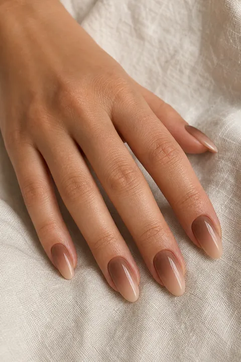 Warm mocha ombre fading into nude tips